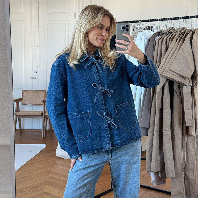 Isla Wellington customer wearing a blue denim jacket
