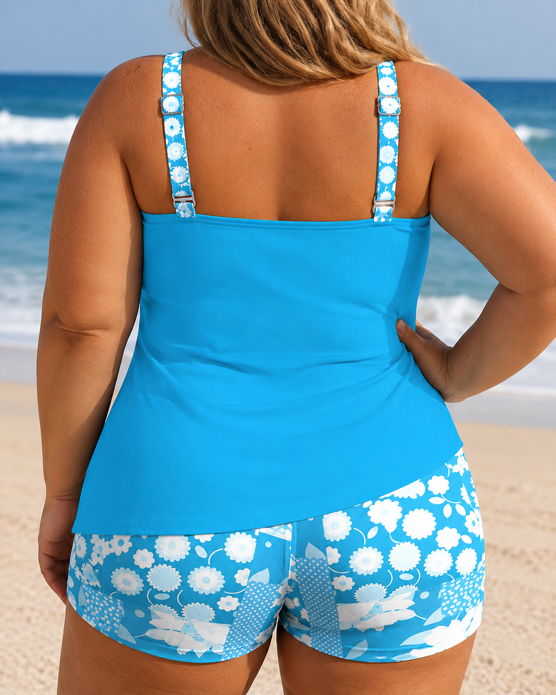 Tankini shorts set in vibrant blue, featuring a solid top and patterned shorts. Wide straps and relaxed fit for comfort.