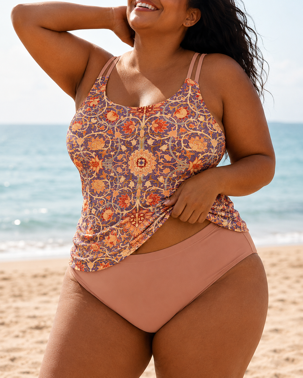 Floral print tankini set with a scooped neckline, adjustable straps, and ruched detailing, paired with solid bottoms.
