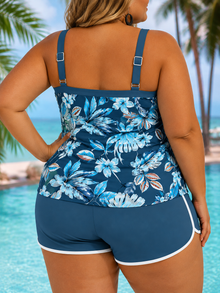 Sleeveless tankini in blue with floral print, featuring adjustable straps and a comfortable fit. Paired with matching shorts.