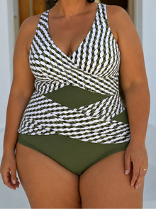 Suri Geometric Cut-Out Wrap One-Piece in green and white, featuring a wrap silhouette and broad straps for support.