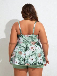 Tropical floral print swim dress with a flowing silhouette, V-neckline, and built-in boyshorts for coverage.