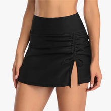 Black swimwear shorts made from a polyester-spandex blend, featuring a side slit and ruched drawstring detail.
